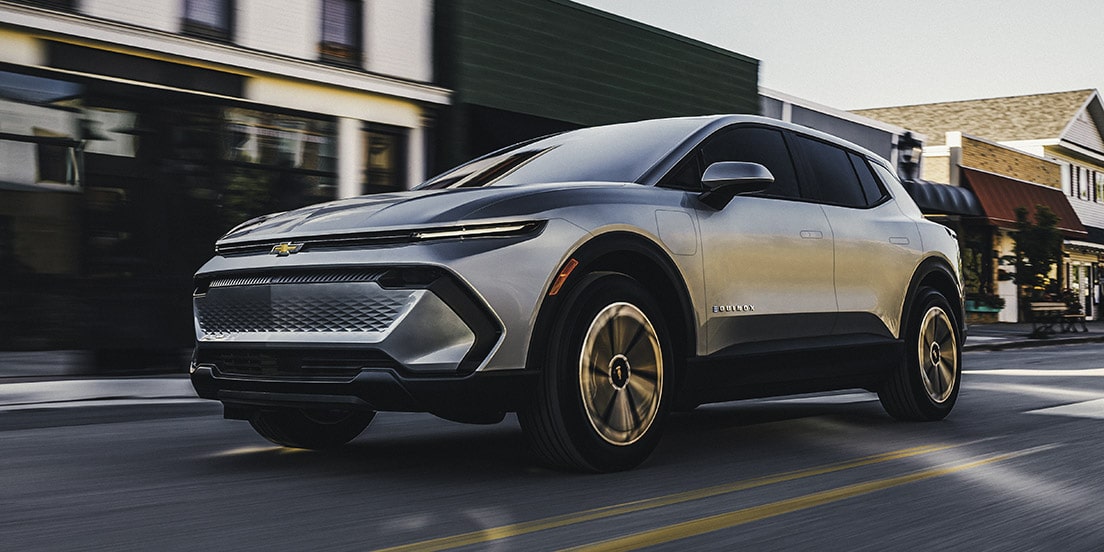 A GM Envolve EV driving in the city.
