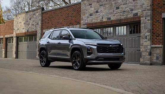 A GM Envolve SUV parked on a driveway.