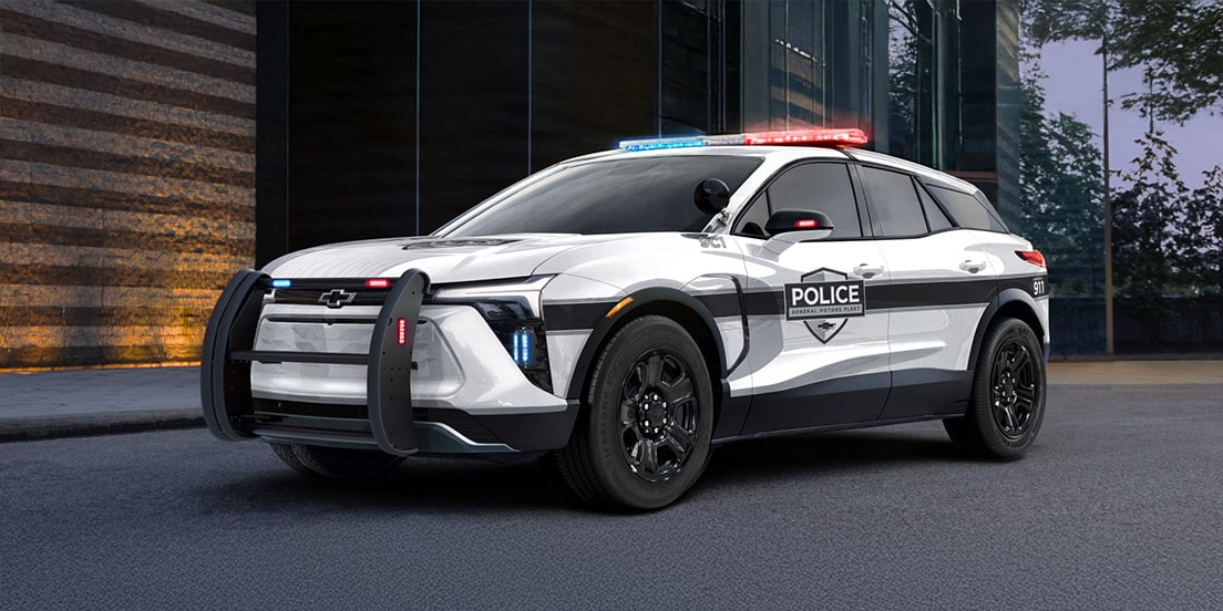 A GM Envolve Police vehicle parked outdoors.