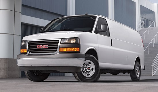 A GM Envolve Van parked outdoors.