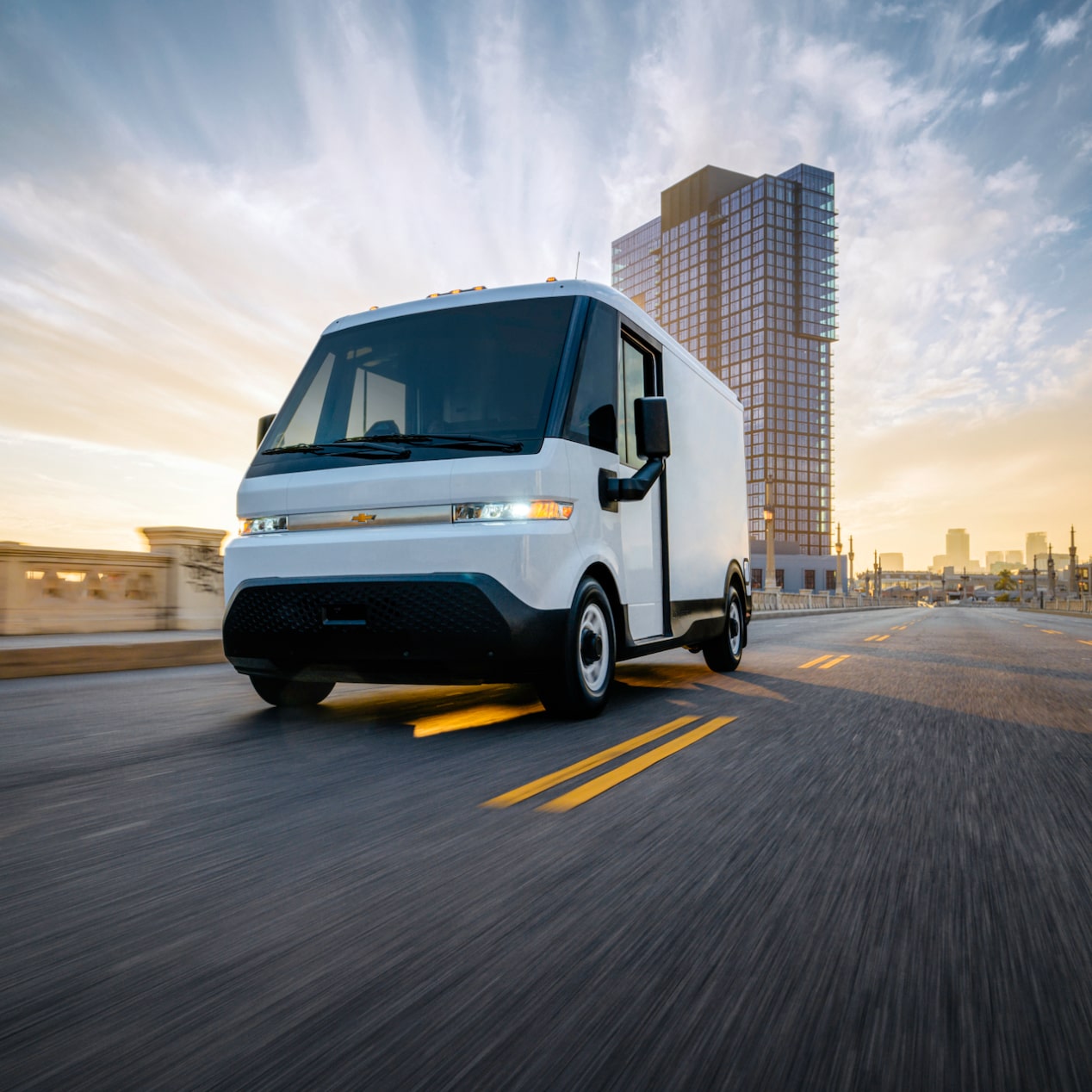A GM Envolve vehicle driving alone on the road.