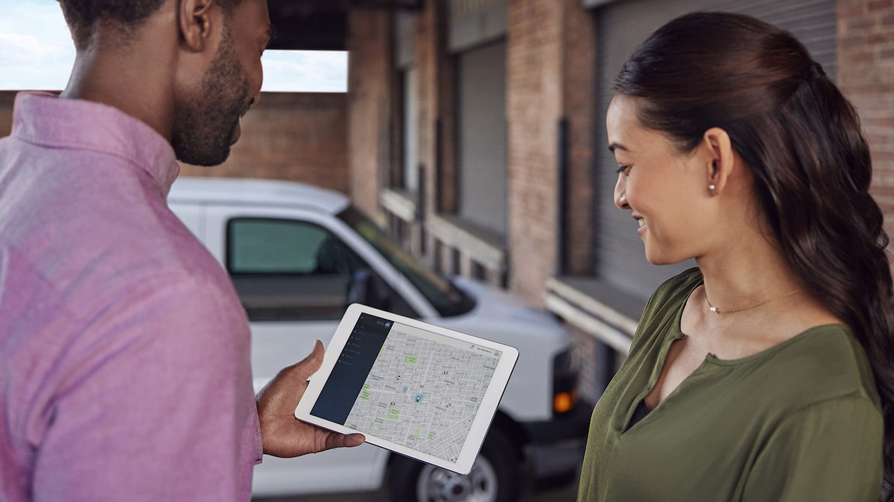 OnStar advisor looking on a computer screen.