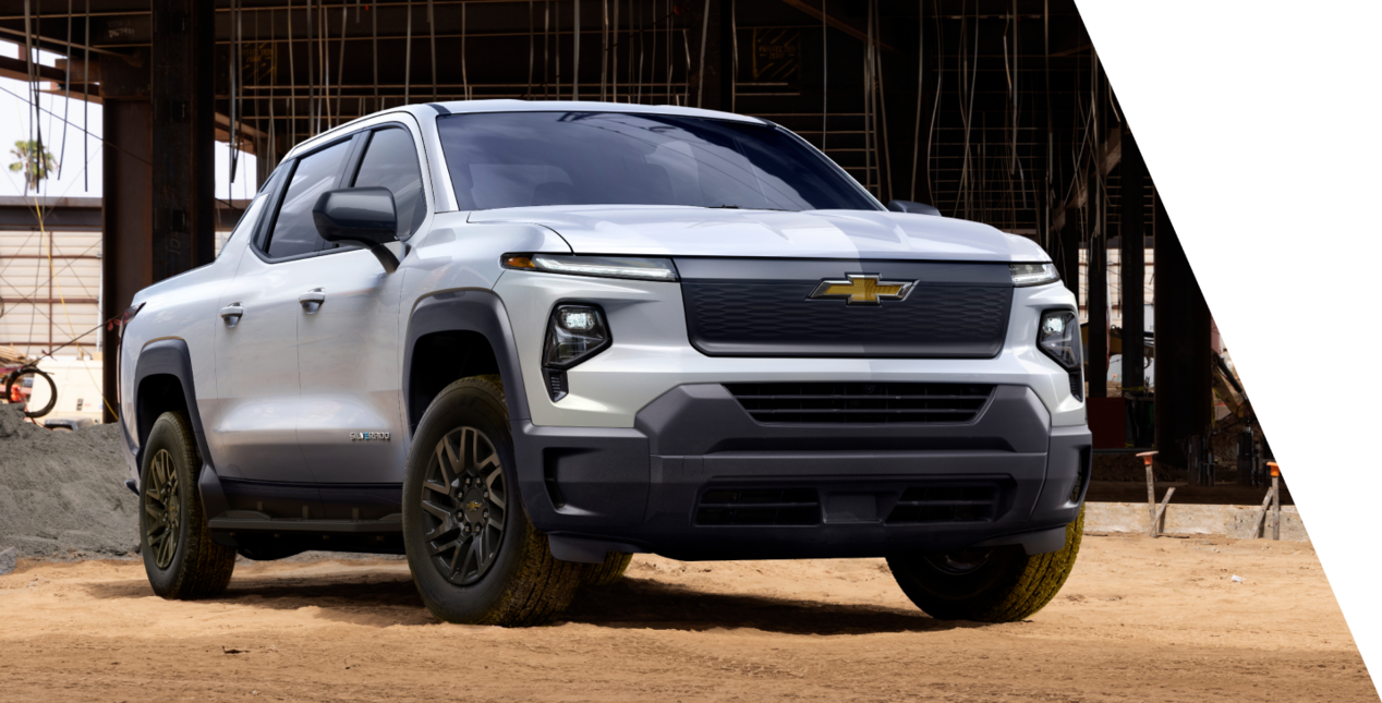 The Chevrolet Silverado EV parked by a construction zone.