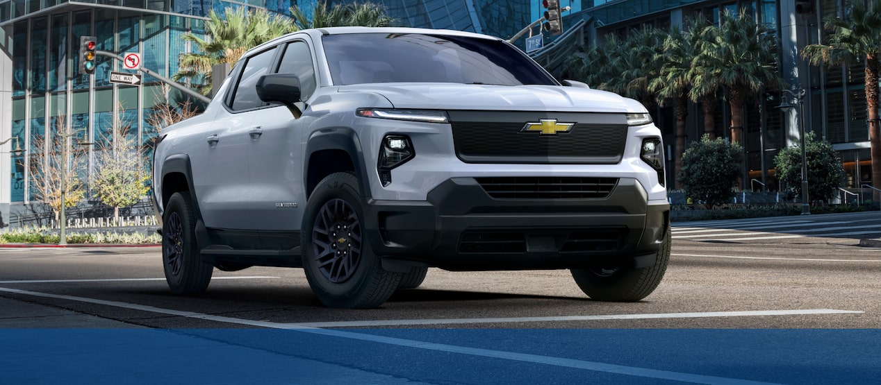 The Chevrolet Silverado EV Work Truck while driving through the city.