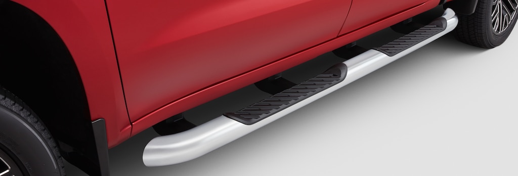 Close-up view of the chrome-colored assist steps of a GM Fleet vehicle.