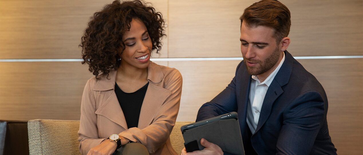 A GM Fleet representative discussing matters to a client.