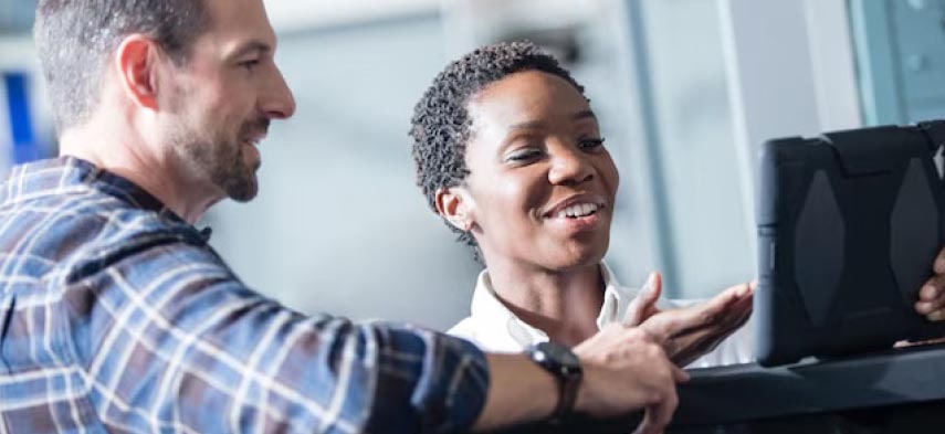 A person discussing matters with a GM Envolve personnel.