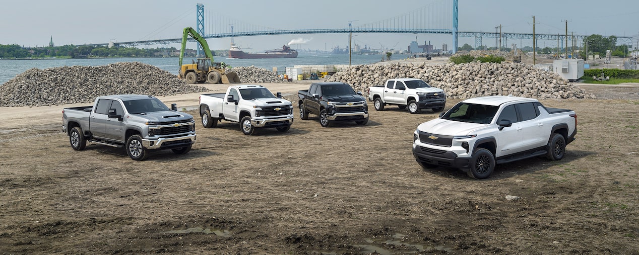 Multiple GM Envolve vehicles parked at a construction site.
