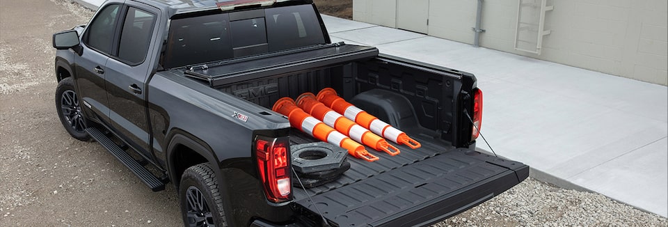 Bags and Tools stored on the Truck Bed of a GM Envolve vehicle