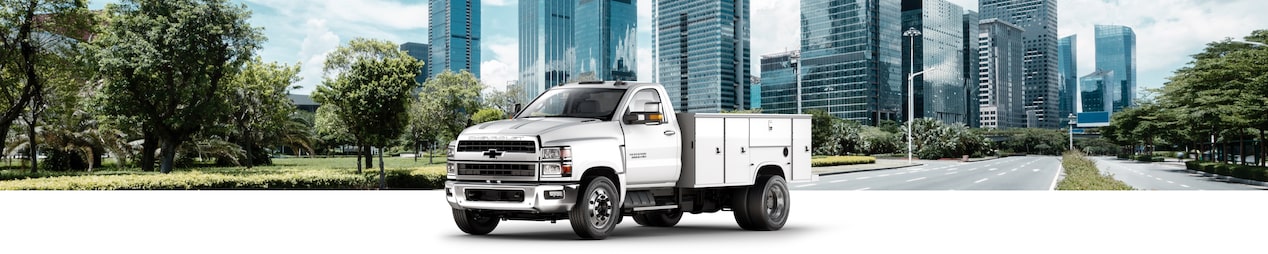 GM Fleet Utility and Service Vehicle with Upfit Applications on a city background.