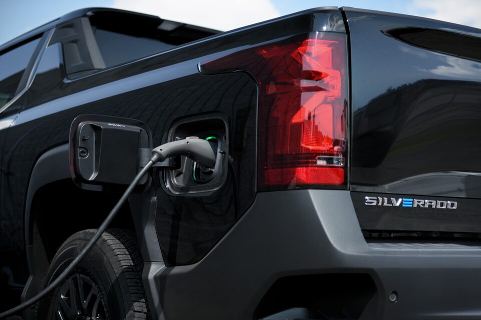 A Chevrolet Silverado EV Truck charging outdoors.