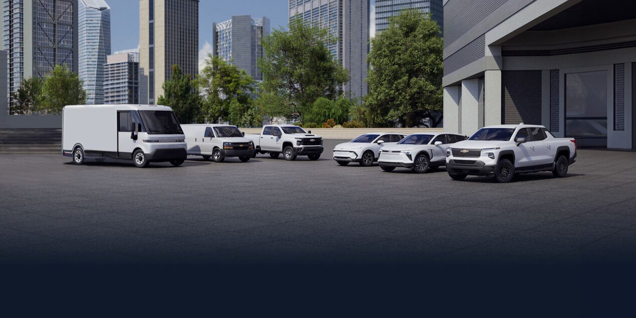 GM Envolve fleet line-up against a city backdrop.