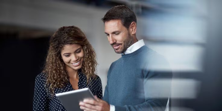 A GM Fleet dealer discussing matters with a client.