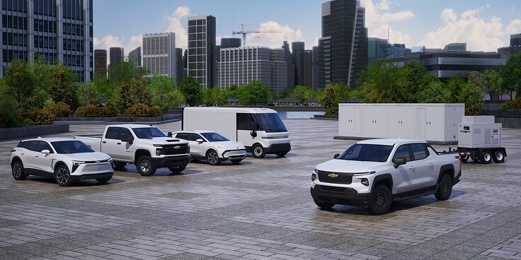 A fleet of various GM Envolve vehicles parked  on a job site.