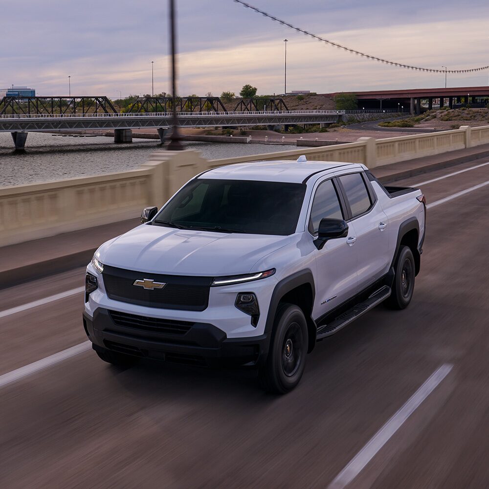 A Silverado EV driving down a highway