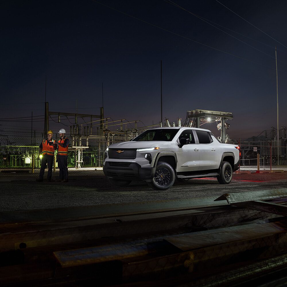 A Silverado EV parked at a jobsite at night.