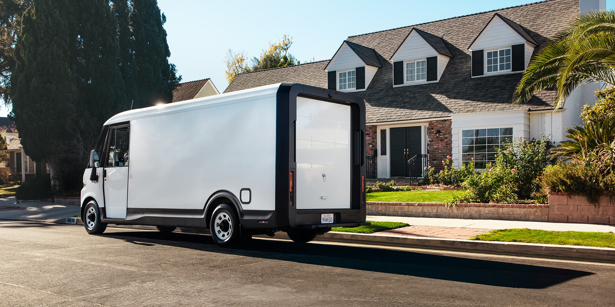 A driver delivers a package in a residential area.