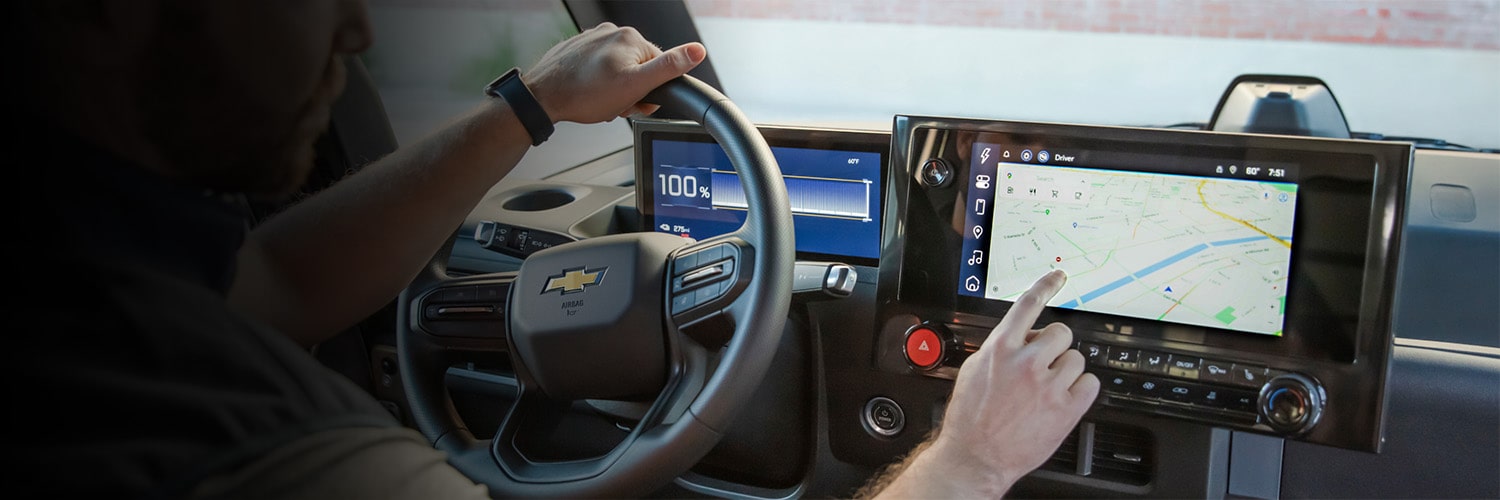 A driver using a Chevrolet BrightDrop infrotainment system