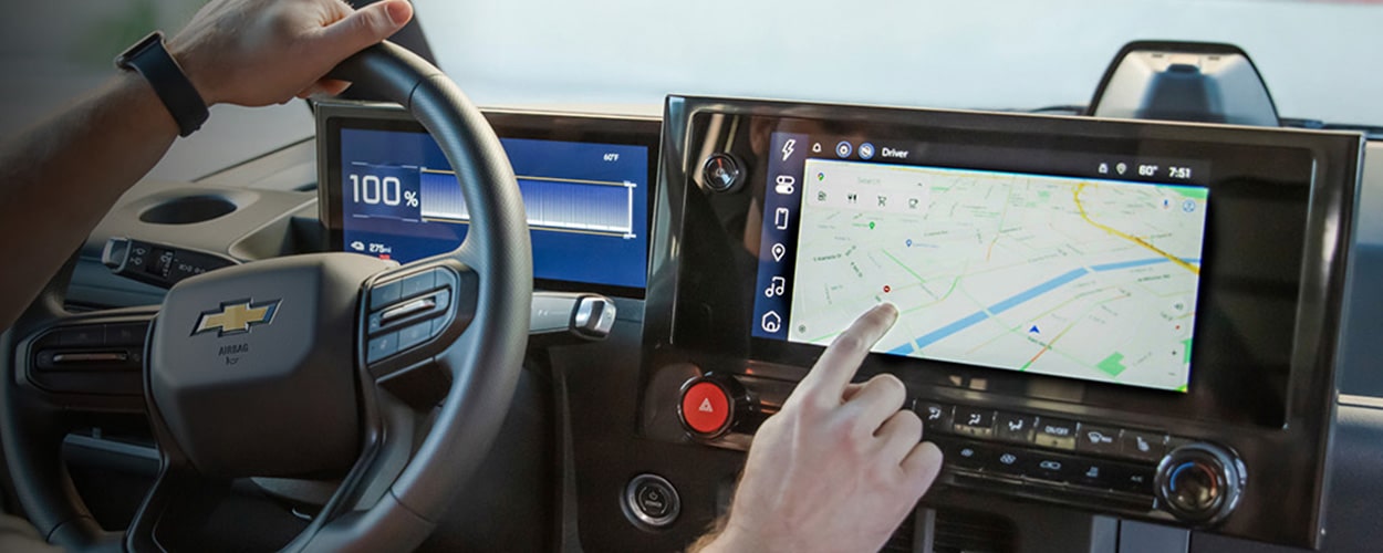 A driver using a Chevrolet BrightDrop infrotainment system