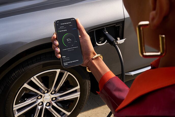 A person using the OnStar app to check her vehicle's health.