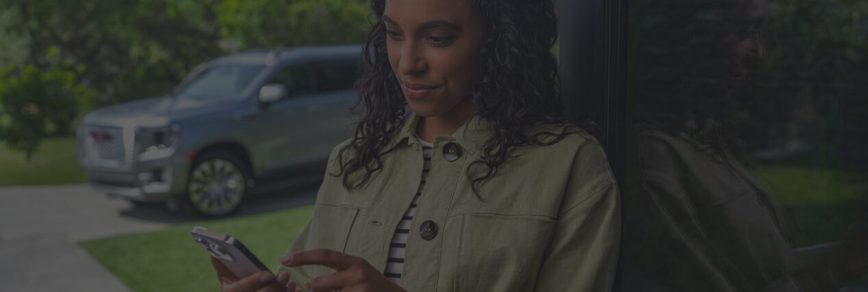 A person looking to access OnStar's vehicle mobile app through a smartphone.