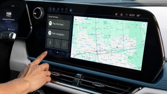 A person accessing Google Maps through the infotainment screen of an OnStar-subscribed GM vehicle.