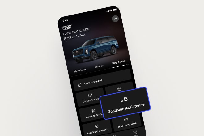 A smartphone displaying myCadillac Mobile App with emphasis on the Roadside Assistance icon.