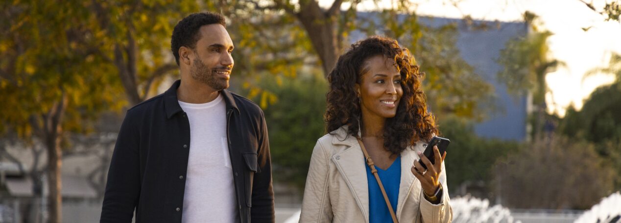 Couple Walking Through the Park in Fall Weather Attire