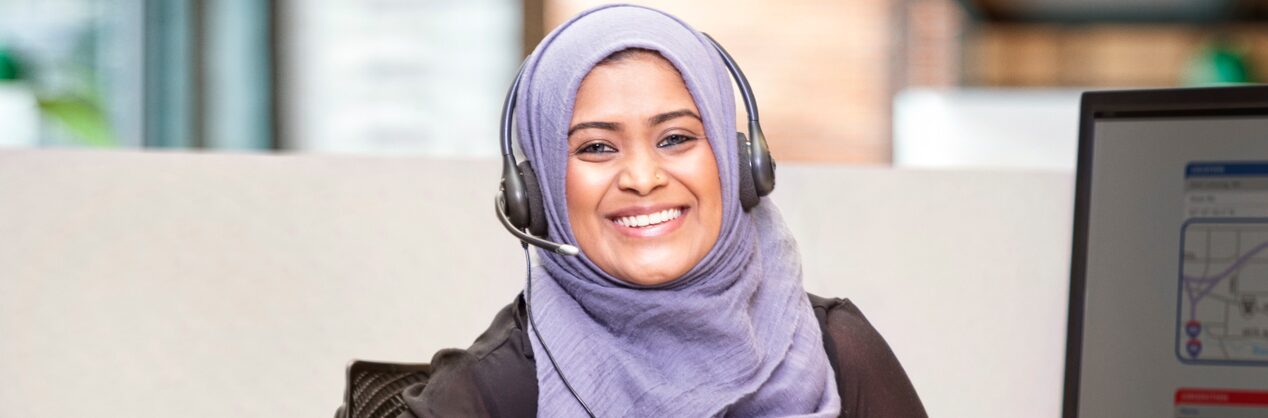 Female OnStar Advisor Smiling Wearing Headset 