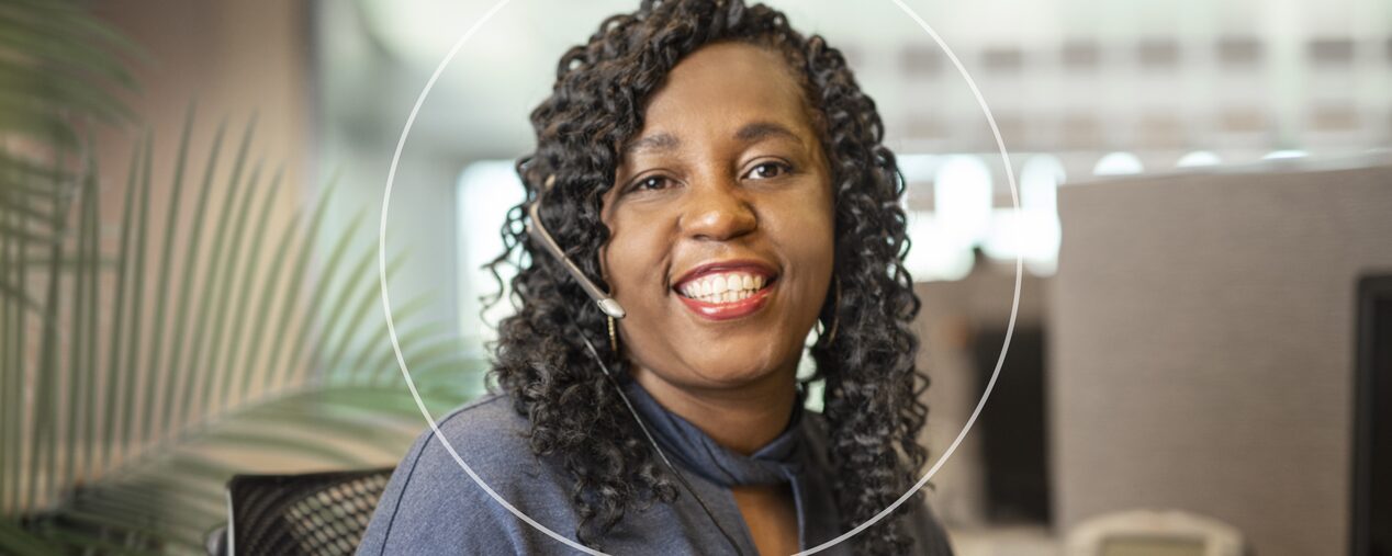 Female OnStar Advisor Smiling with Headset on