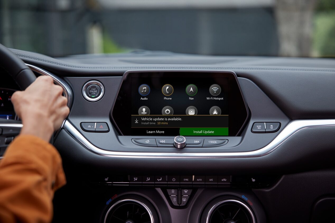View of Center Console & Infotainment System With Person Driving