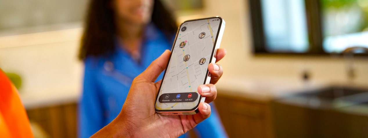 Close up of a person holding phone while guardian app is open